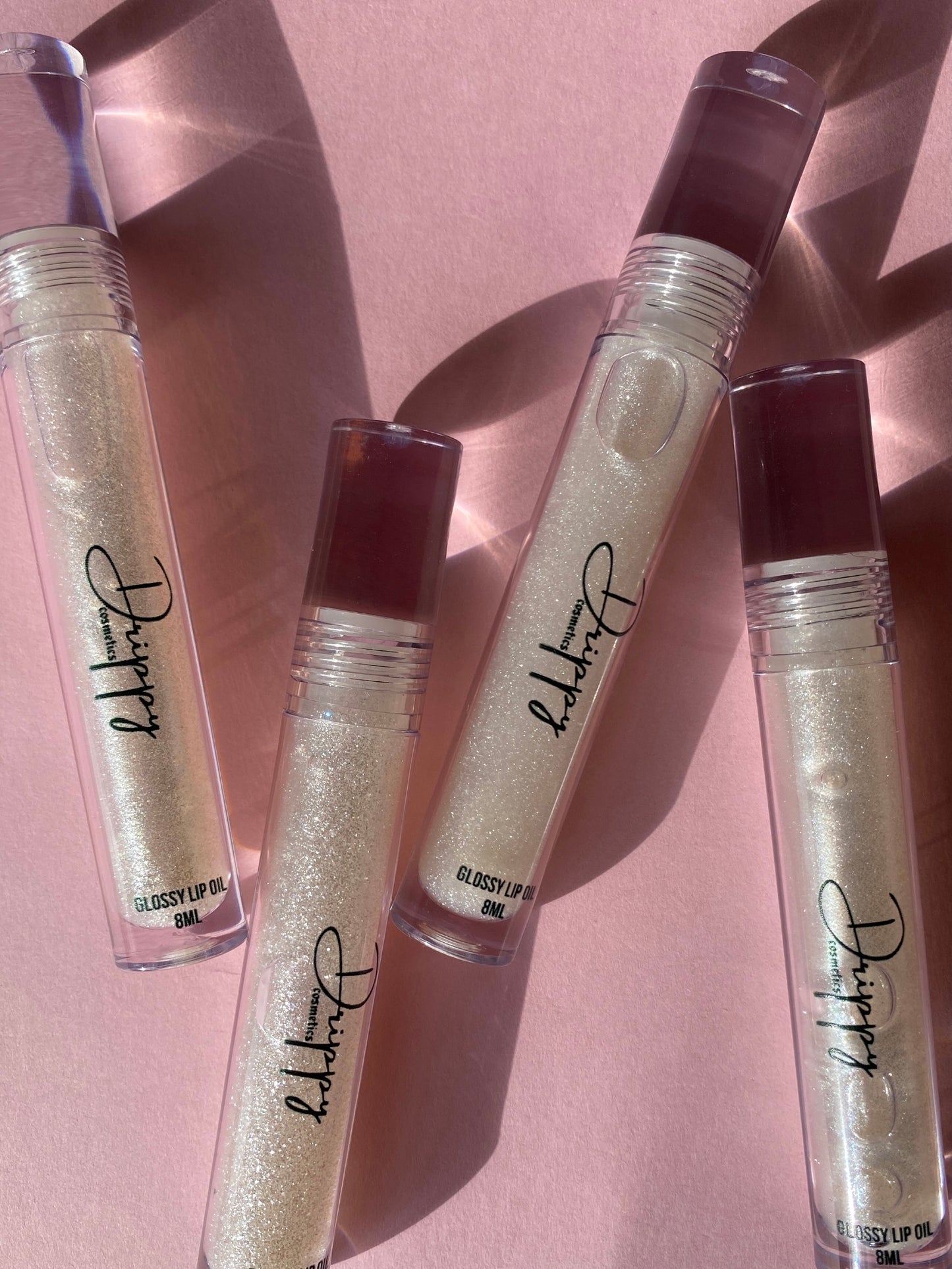 DRIPPY COSMETICSIcy Glossy Lip OilNot as thin as a lip oil & not as thick and sticky as a Lip gloss.
Our light-weight, silky formula gives you the shine of a Lip gloss with less stickiness and m