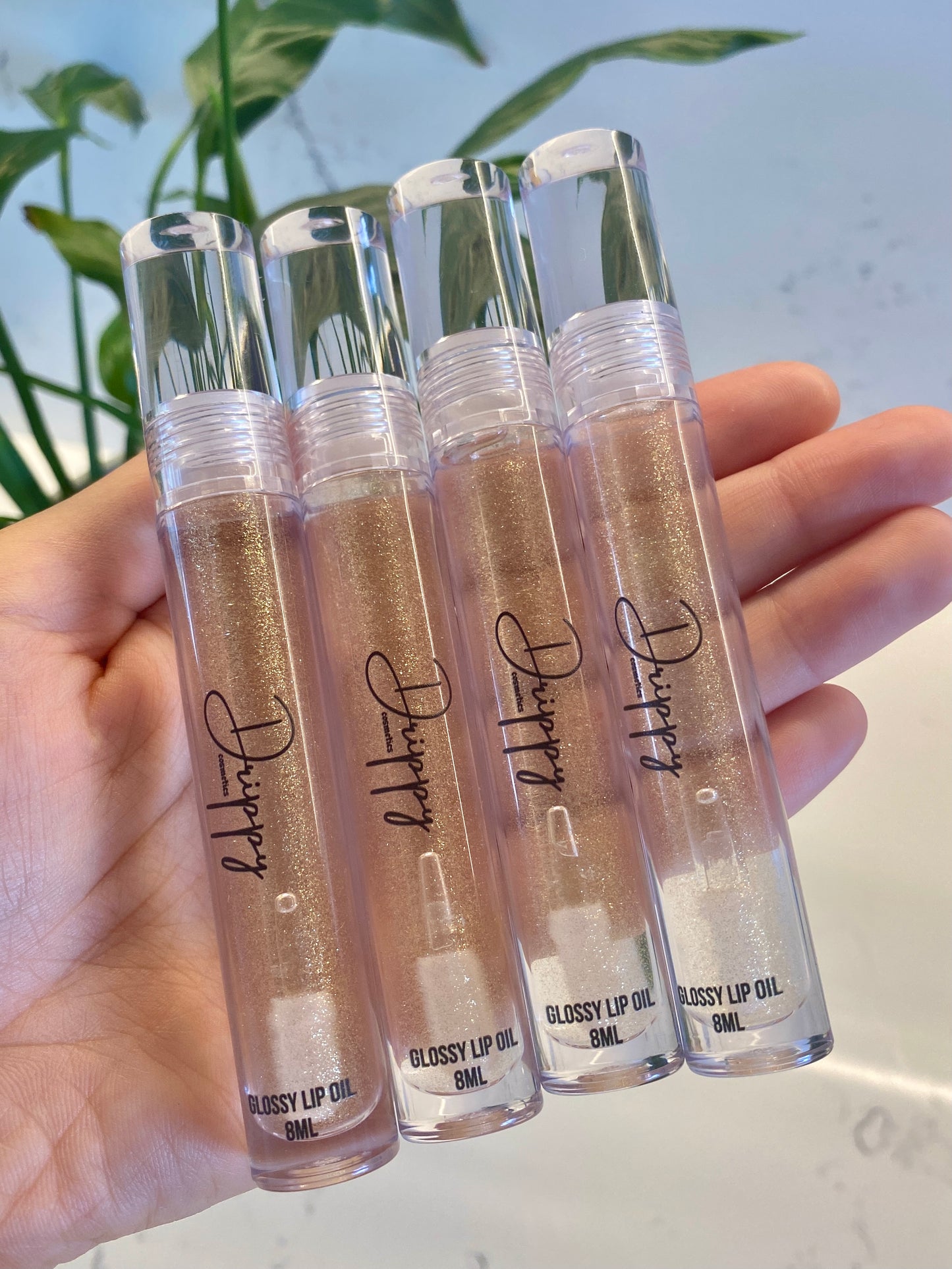 DRIPPY COSMETICSVanilla Dreams Glossy Lip OilNot as thin as a lip oil & not as thick and sticky as a Lip gloss.
Our light-weight, silky formula gives you the shine of a Lip gloss with less stickiness and m
