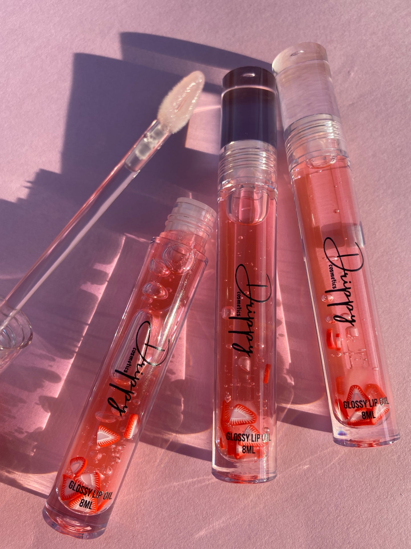 DRIPPY COSMETICSJuicy Strawberry Glossy Lip Oil
Not as thin as a lip oil & not as thick and sticky as a Lip gloss.
Our light-weight, silky formula gives you the shine of a Lip gloss with less stickiness and