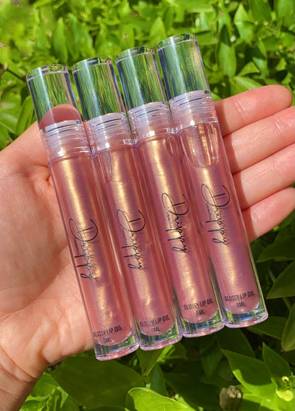 DRIPPY COSMETICSGolden Hour Glossy Lip OilNot as thin as a lip oil &amp; not as thick and sticky as a Lip gloss. 
Our light-weight, silky formula gives you the shine of a Lip gloss with less stickiness and m