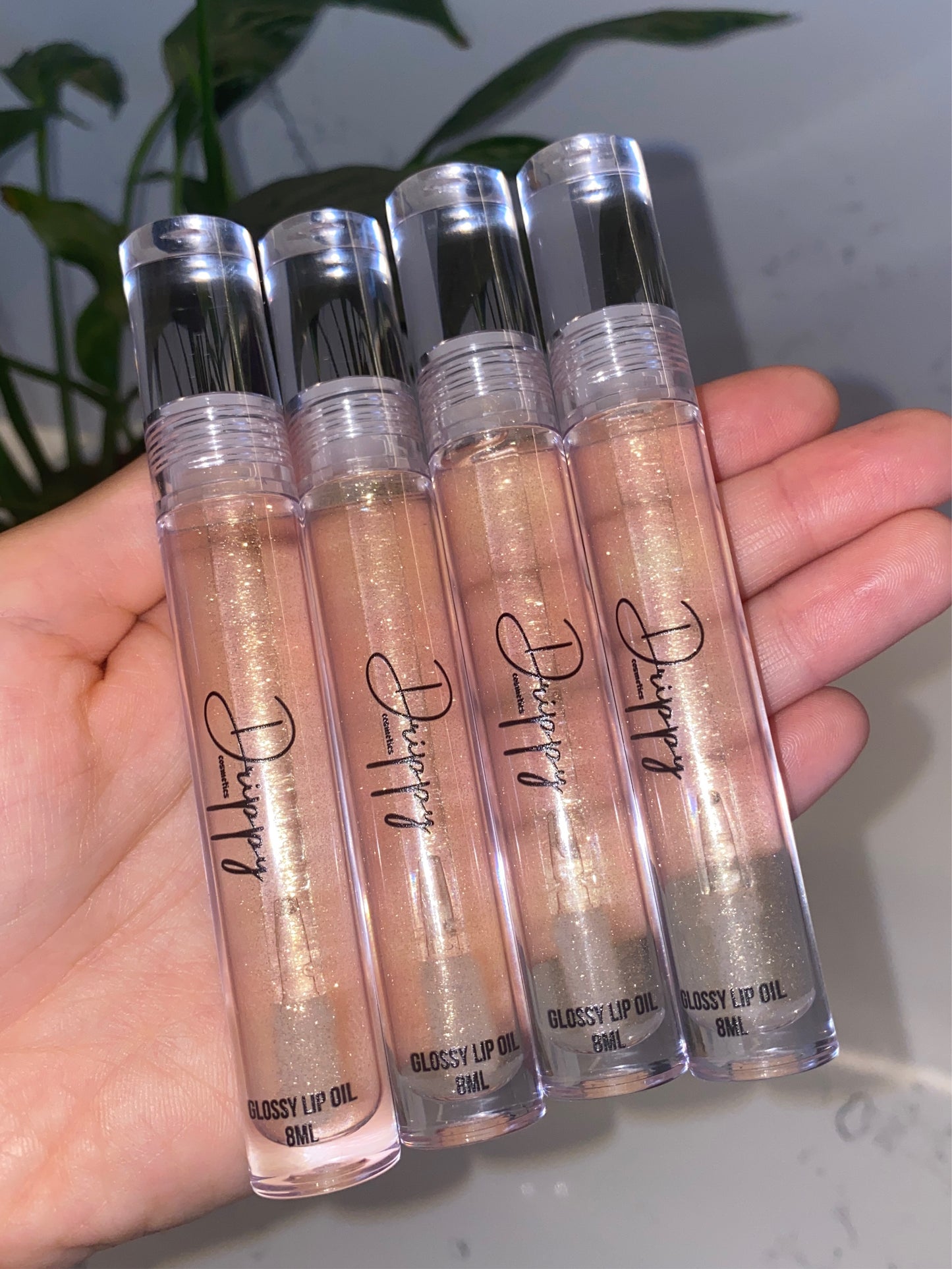 DRIPPY COSMETICSVanilla Dreams Glossy Lip OilNot as thin as a lip oil &amp; not as thick and sticky as a Lip gloss. 
Our light-weight, silky formula gives you the shine of a Lip gloss with less stickiness and m