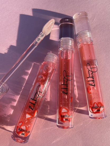 DRIPPY COSMETICSJuicy Strawberry Glossy Lip Oil
Not as thin as a lip oil &amp; not as thick and sticky as a Lip gloss. 
Our light-weight, silky formula gives you the shine of a Lip gloss with less stickiness and 