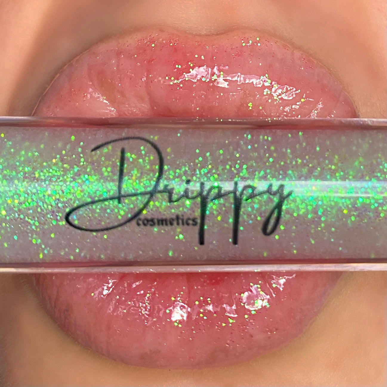 DRIPPY COSMETICSCoconut Sparkle Glossy Lip Oil
Not as thin as a lip oil &amp; not as thick and sticky as a Lip gloss. 
Our light-weight, silky formula gives you the shine of a Lip gloss with less stickiness and 