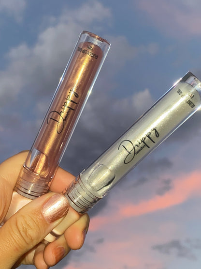 DRIPPY COSMETICSGolden Hour Glossy Lip OilNot as thin as a lip oil &amp; not as thick and sticky as a Lip gloss. 
Our light-weight, silky formula gives you the shine of a Lip gloss with less stickiness and m