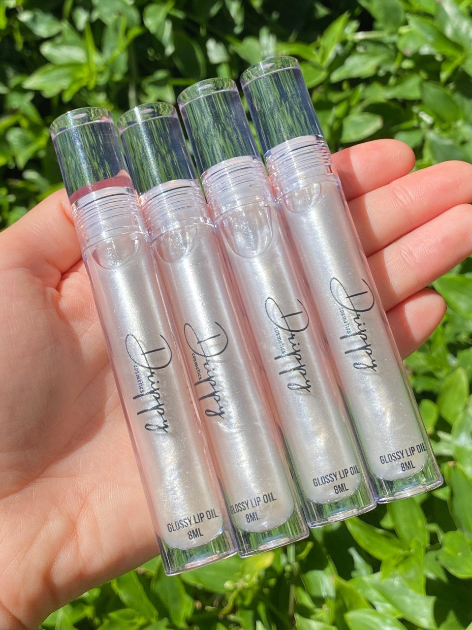 DRIPPY COSMETICSIcy Glossy Lip OilNot as thin as a lip oil &amp; not as thick and sticky as a Lip gloss. 
Our light-weight, silky formula gives you the shine of a Lip gloss with less stickiness and m